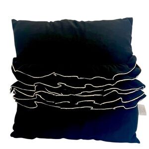 Elegant Black and Cream Ruffled Throw Pillow by Daisy Fuentes.